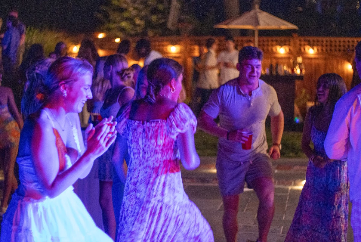 Guests celebrating together on a colorful dance floor